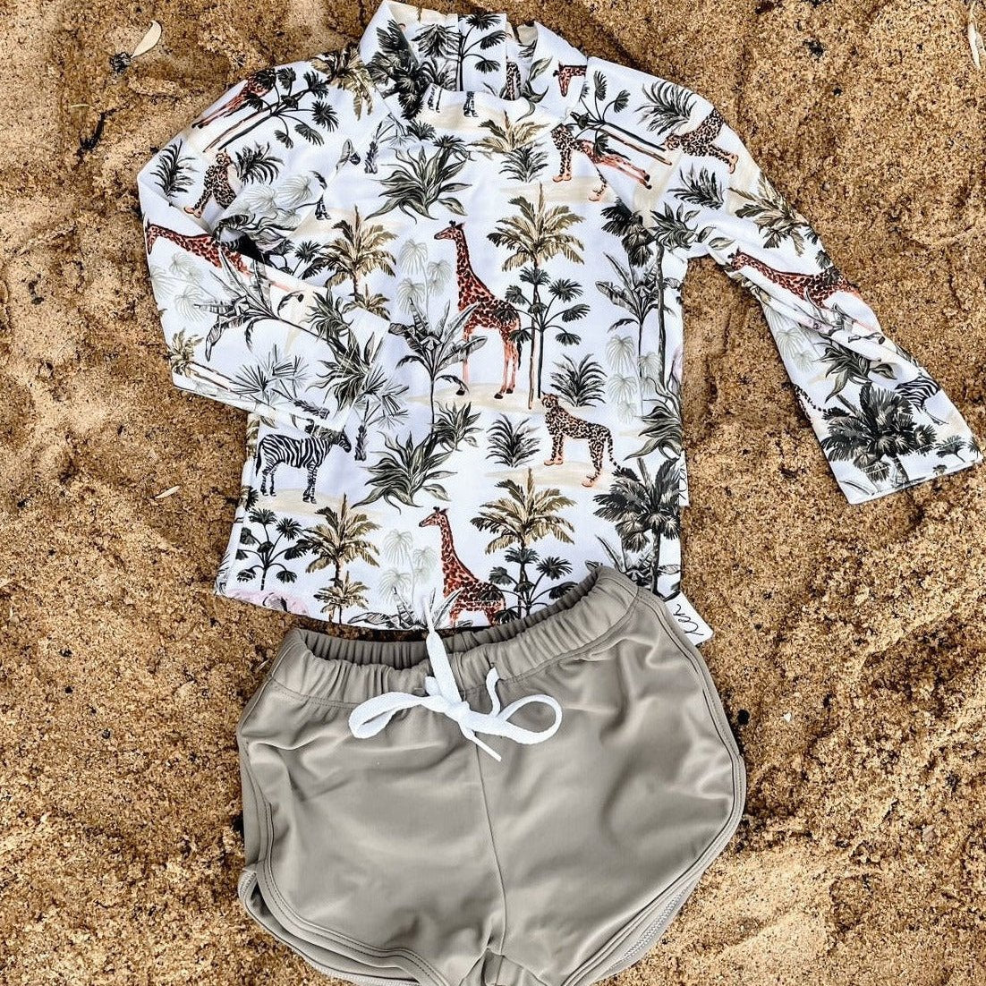 Baby and childs swimsuit with girrafes, zebras, tigers and elephants on it. Boys swimwear