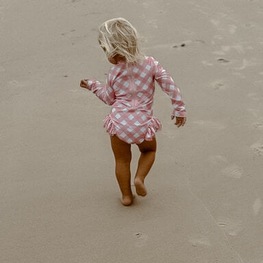 pink ginham toddler and baby girls swimsuit. newborn swimsuit sizes also available.