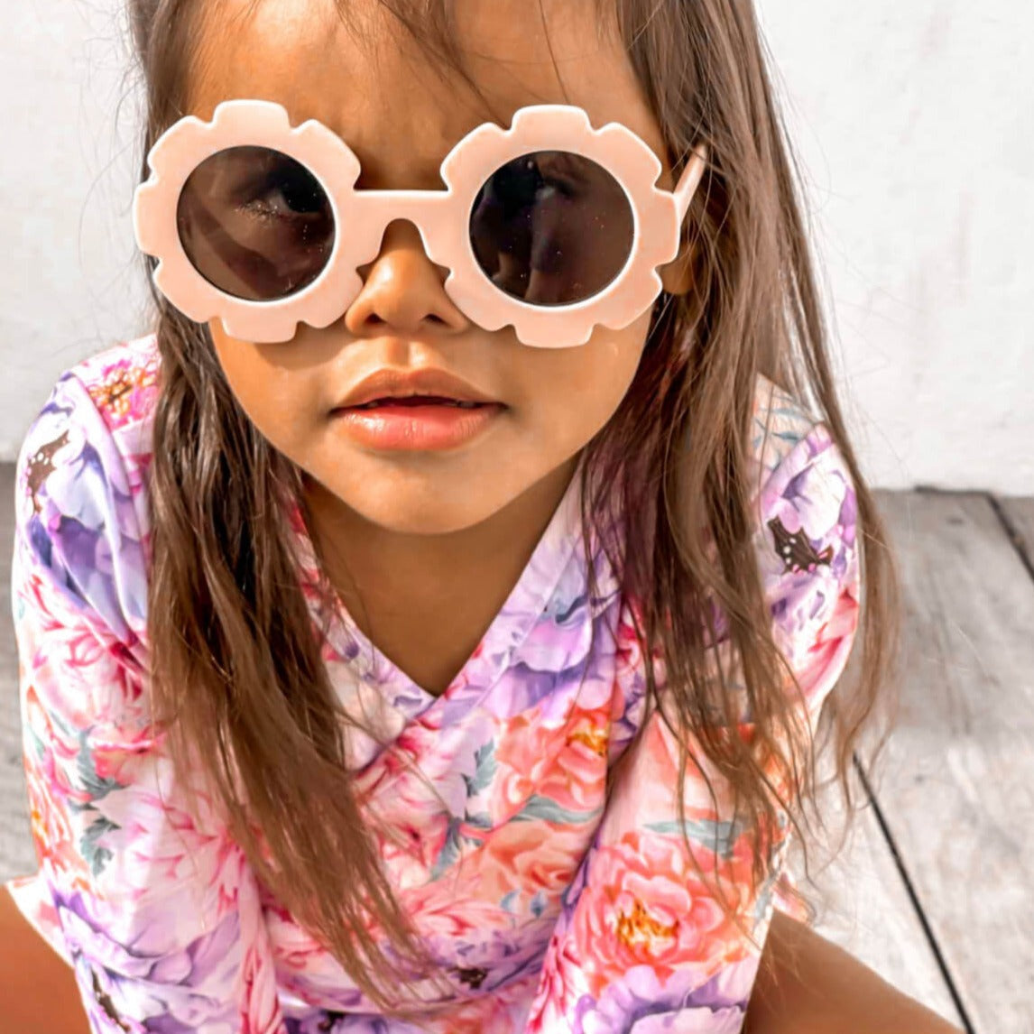 toddler girl wearing a two piece ballerina style floral premium swim set